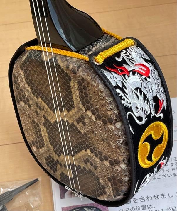 三線 沖縄 両面蛇皮 表側強化二重張り カラクイ1本弦2本新品交換 三線