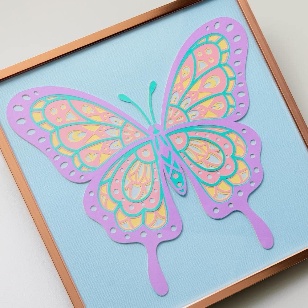 A detailed layered butterfly design cut from various colors of Smart Paper Sticker Cardstock, framed.