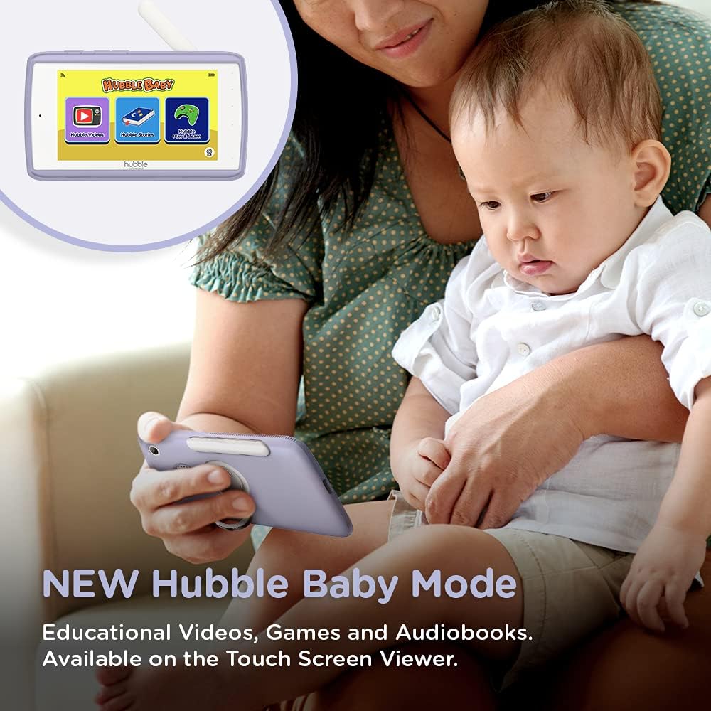 Child holding the parent unit in Hubble Baby Mode, showing educational content