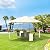 Outsunny 10' x 10' Patio Gazebo, Outdoor Gazebo Modern Canopy Shelter with Vents Roof and Steel Decorative Columns, for Garden, Lawn, Backyard and Deck