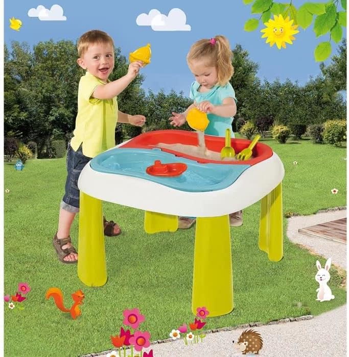 Two children playing with the Smoby Sand and Water Activity Table outdoors