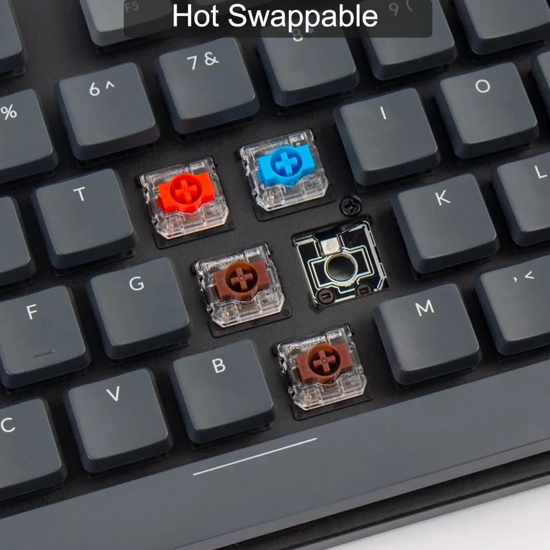 Close-up of Keychron K5 SE keyboard showing individual hot-swappable mechanical switches being removed and inserted, with different colored switches visible.