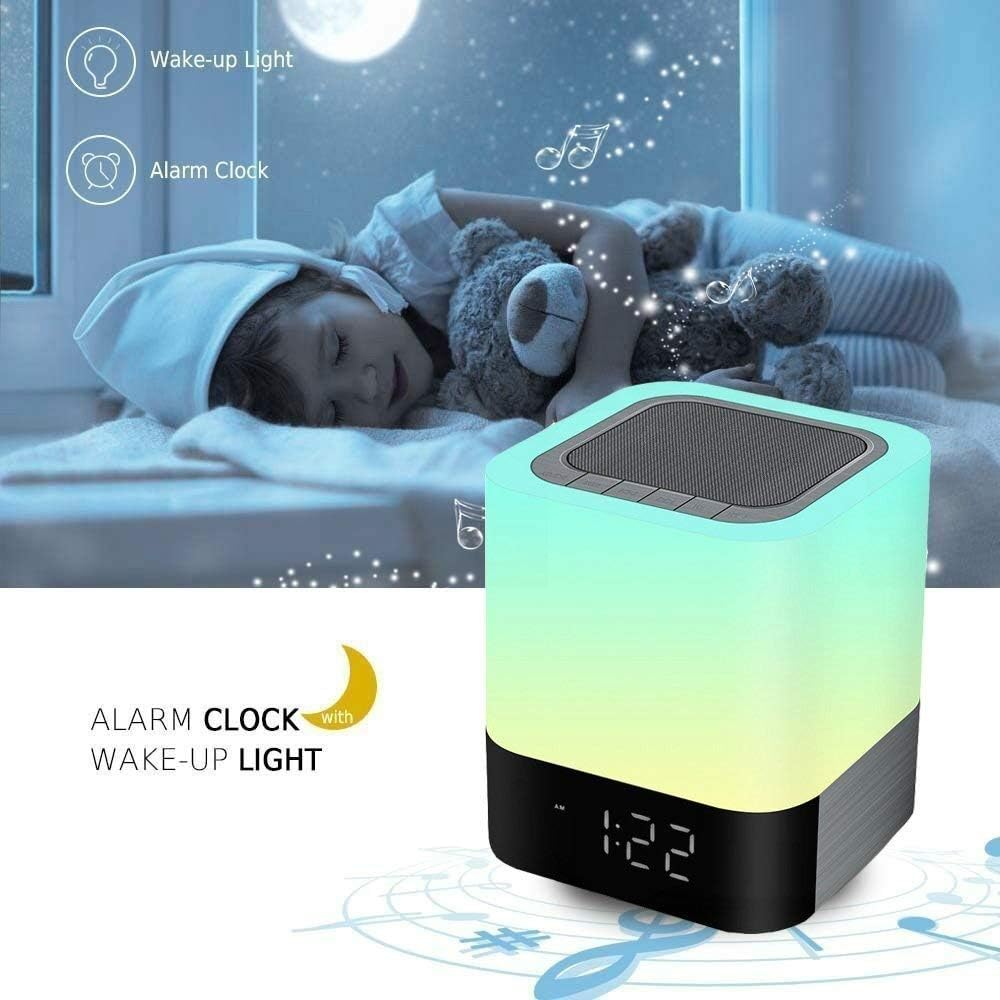 A child sleeping peacefully with the Aisuo Night Light acting as an alarm clock and wake-up light beside them.