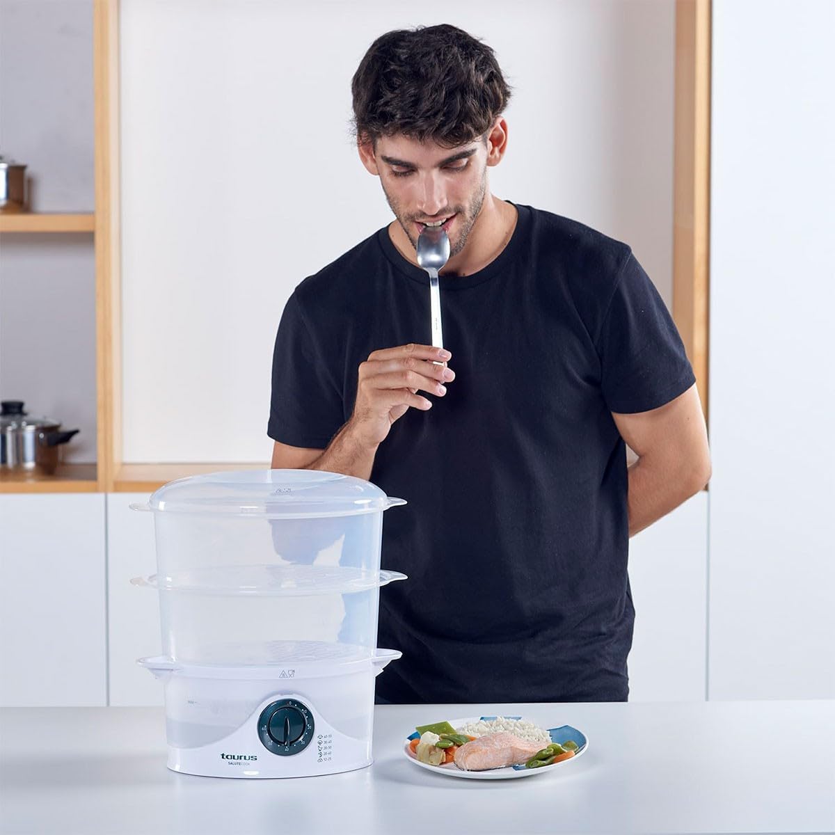 Man tasting steamed food from the Taurus Salutecook Steamer