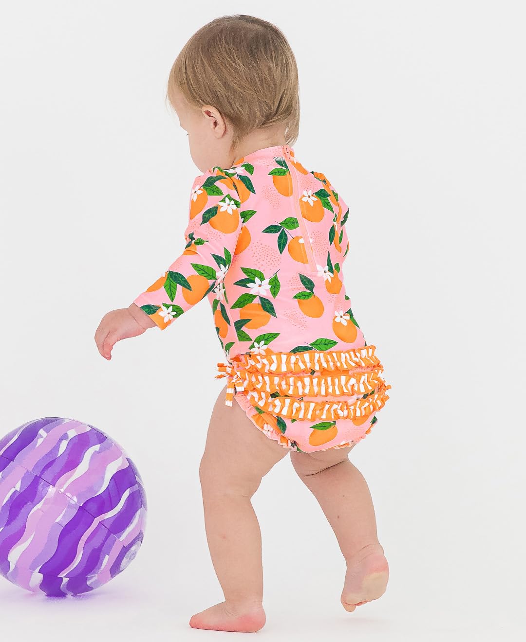 RuffleButts Traje de baño de una Pieza con protección Solar UPF 50 para niñas, Estampado novedoso, de Manga Larga y Cremallera, Color neón, 3-6 Meses