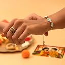 Rakhi Gift Hamper for Bhayia & Bhabhi – 12-Item Combo with Evil Eye Rakhi & Bracelet, Dry-fruit Chocolate Laddoos, Cashews & Almonds, Millet Namkeen & Roli Chawal | Raksha Bandhan Gift Box gallery image