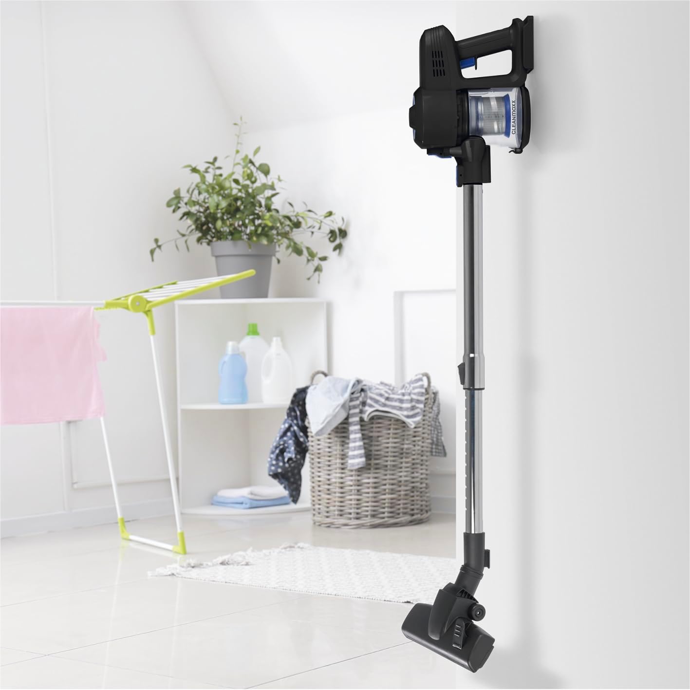CLEANmaxx vacuum cleaner mounted on a wall in a utility room