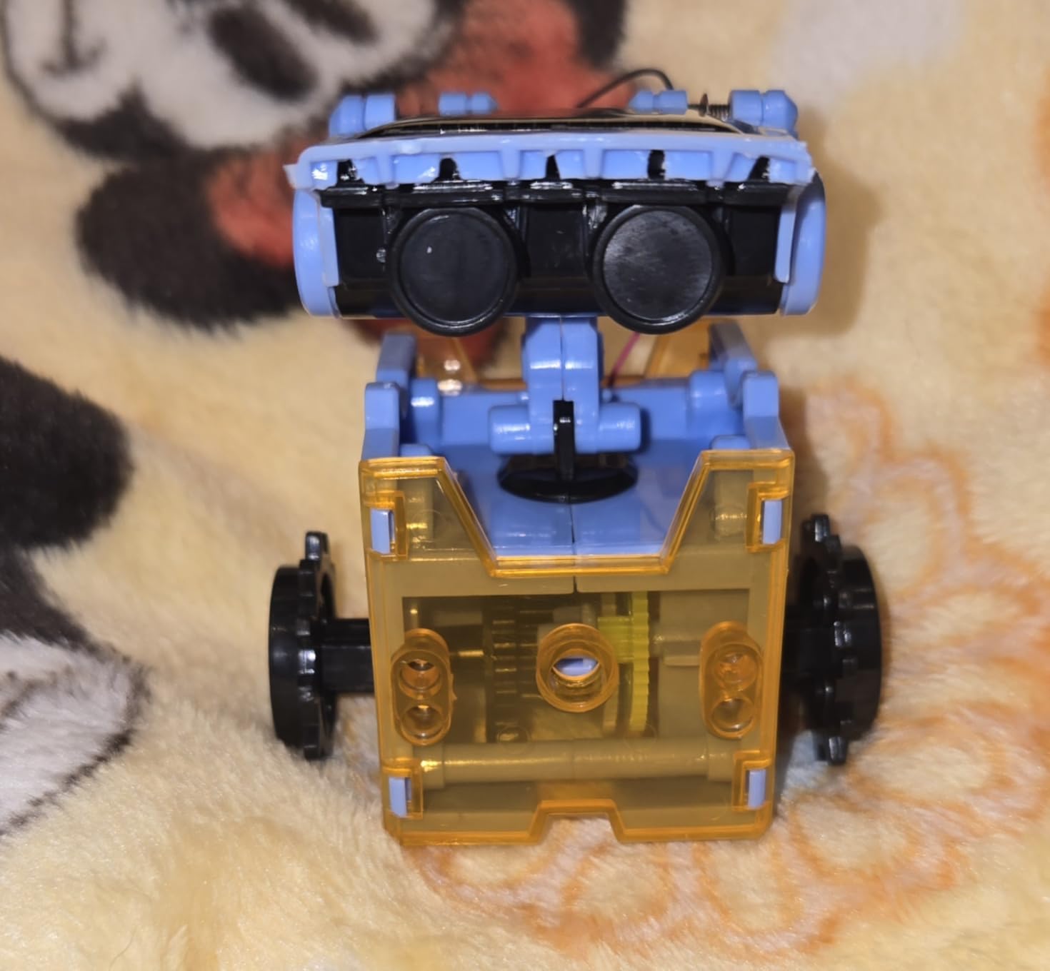 Sillbird 12-in-1 Solar Robot Building Kit showing one of the completed robot configurations with solar panel