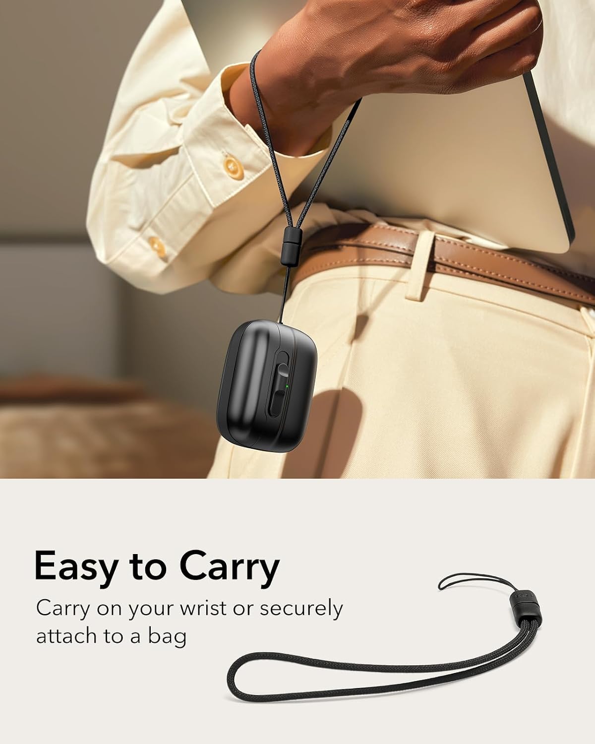 Person carrying ESR case with lanyard on wrist and attached to a bag