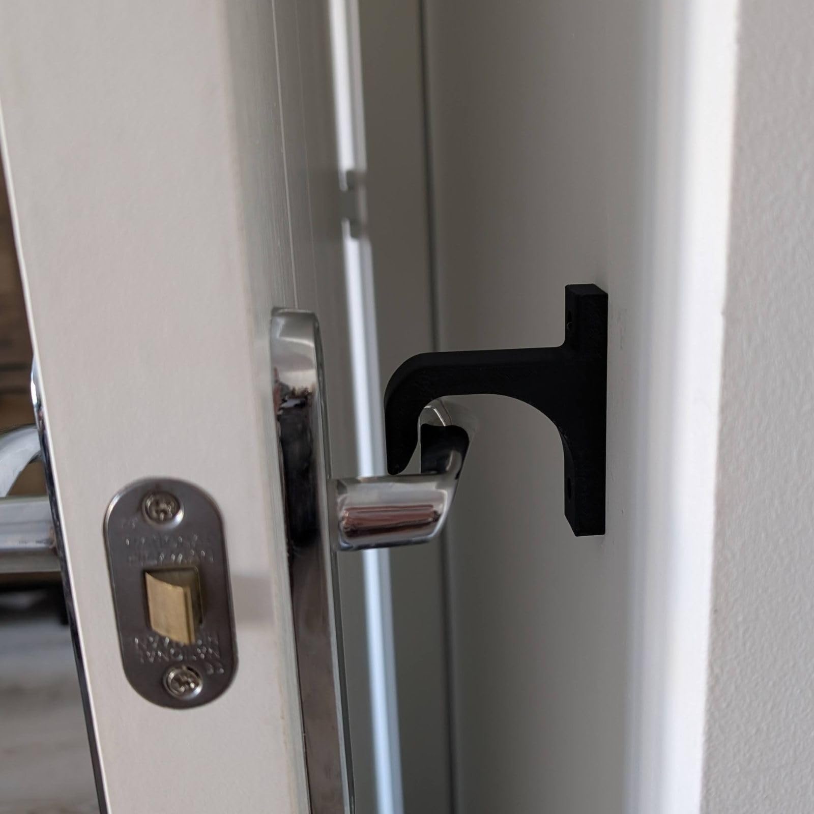 Alchemy Collectives Universal Door Handle Hook Stay | Wall Mounted Door Holder for Indoor & Outdoor Use | Holds Doors Open | Fits Most Lever Handles | Includes Fixings | White, Black, Grey (Black)