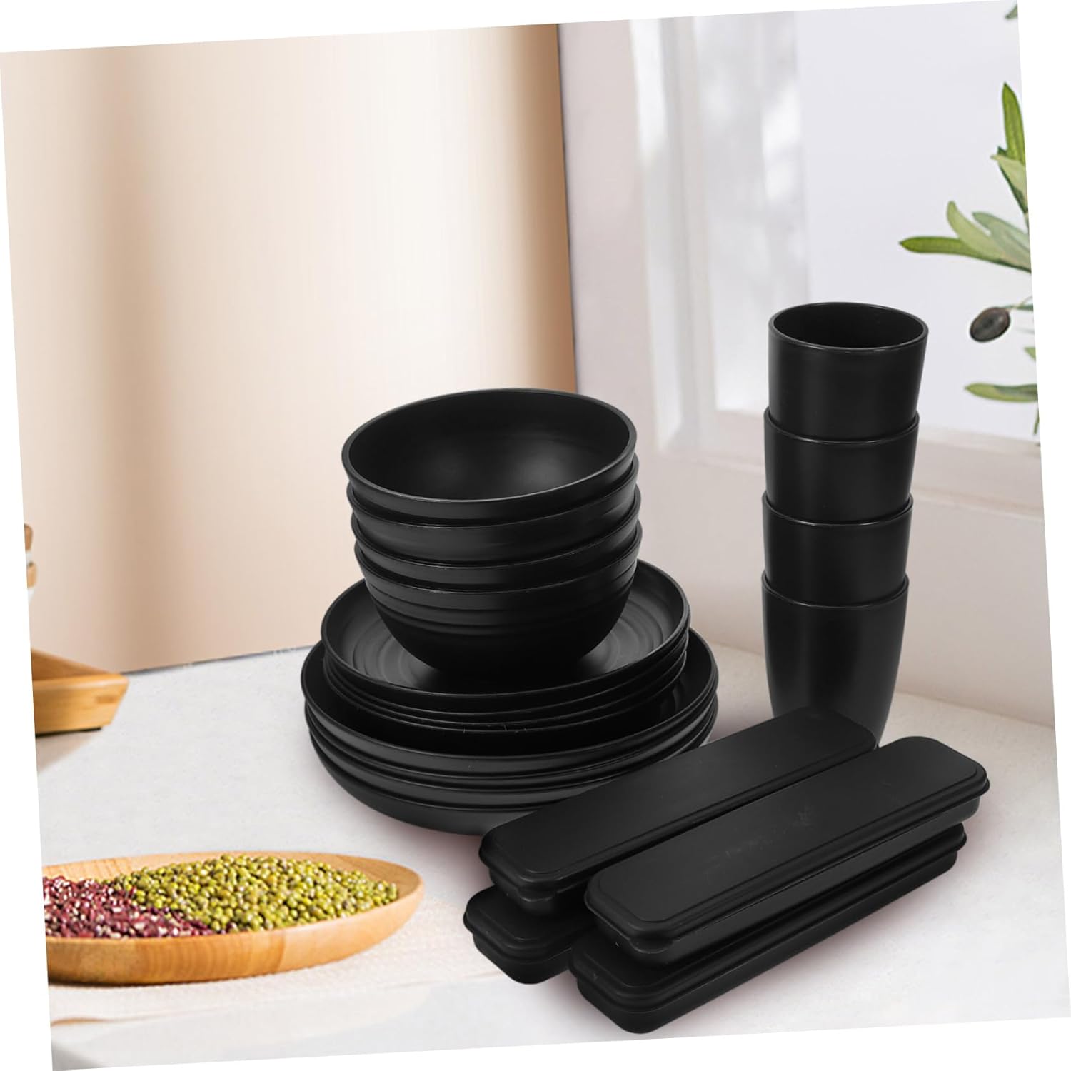 28-Piece Black Dinnerware Set Sturdy Camping Plates Bowls Cups and Utensils Reusable Cutlery for Parties and Outdoor Use for Picnics and Family Gatherings