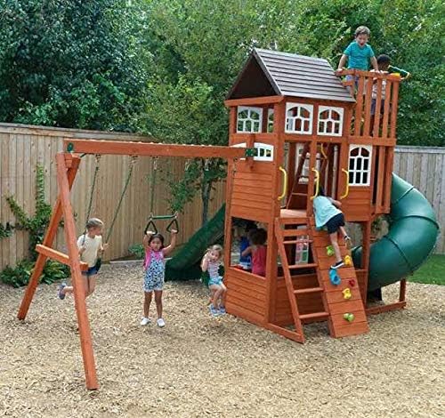 KidKraft Cedar Summit Play Center from an angle, highlighting the swing set and main structure