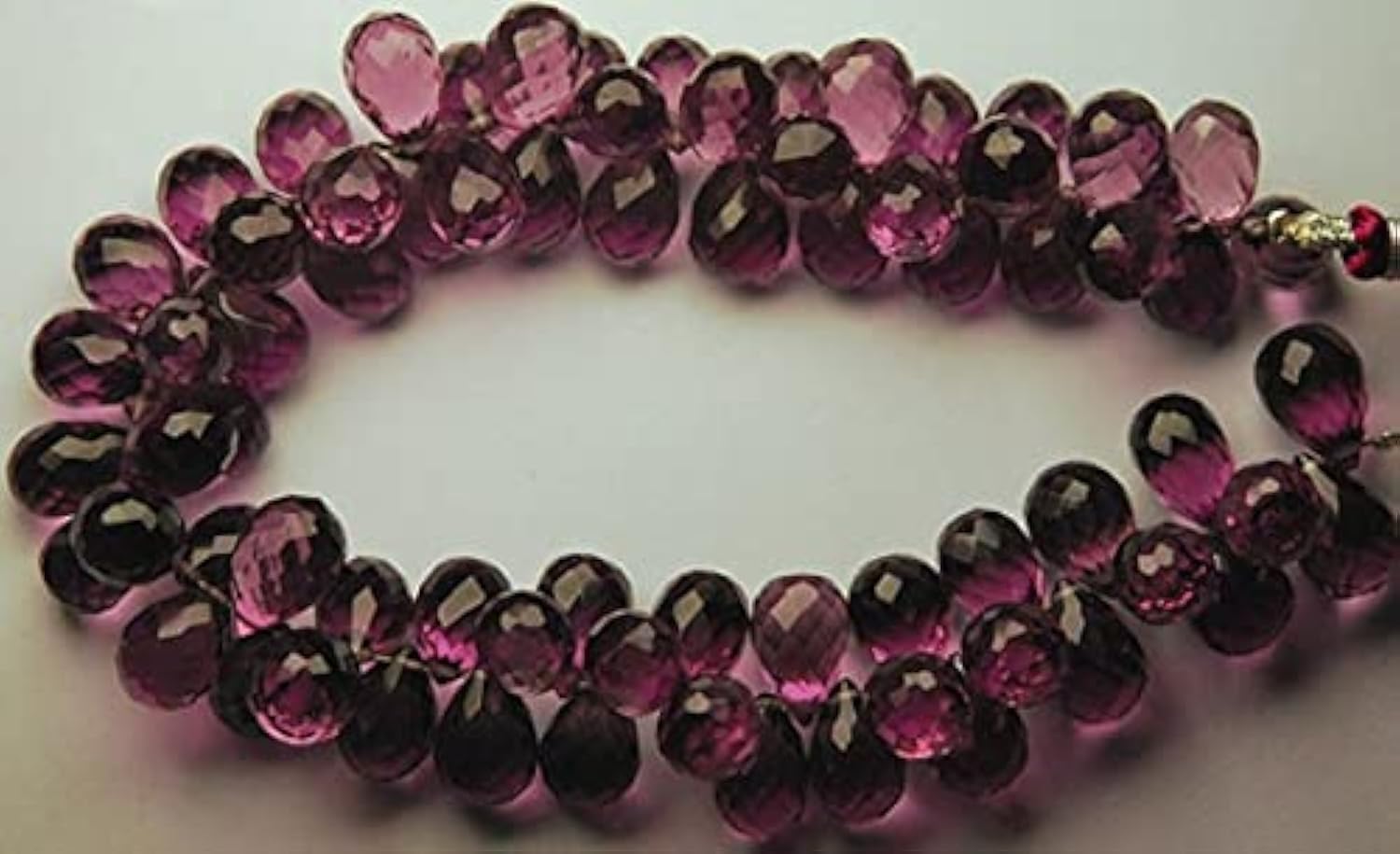 Kunzite rose briolette goutte facettée pour création de collier en perles