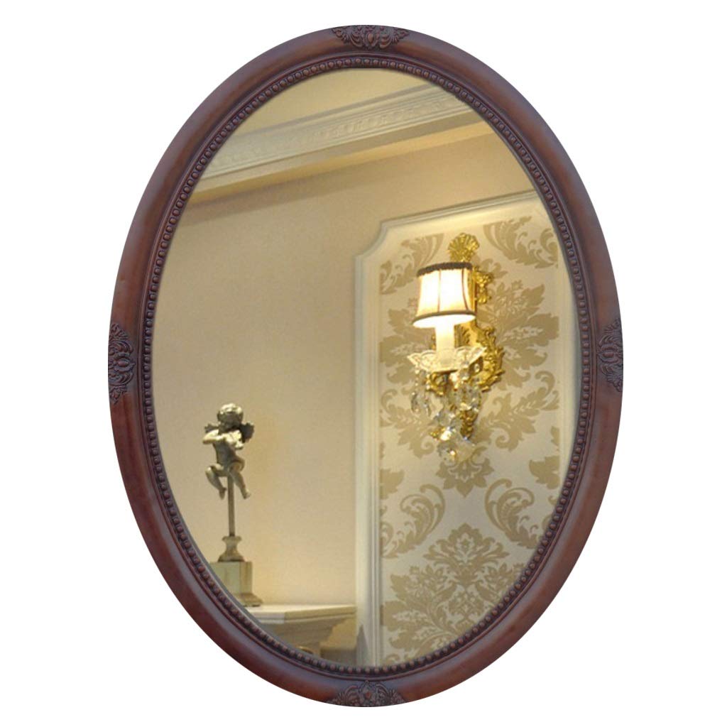 Miroir de beauté de forme ovale avec cadre rétro raffiné