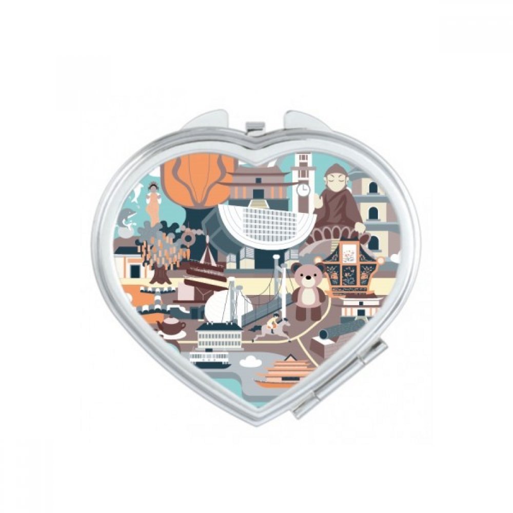 Miroir compact mignon en forme de cœur parfait pour les retouches de maquillage en voyage
