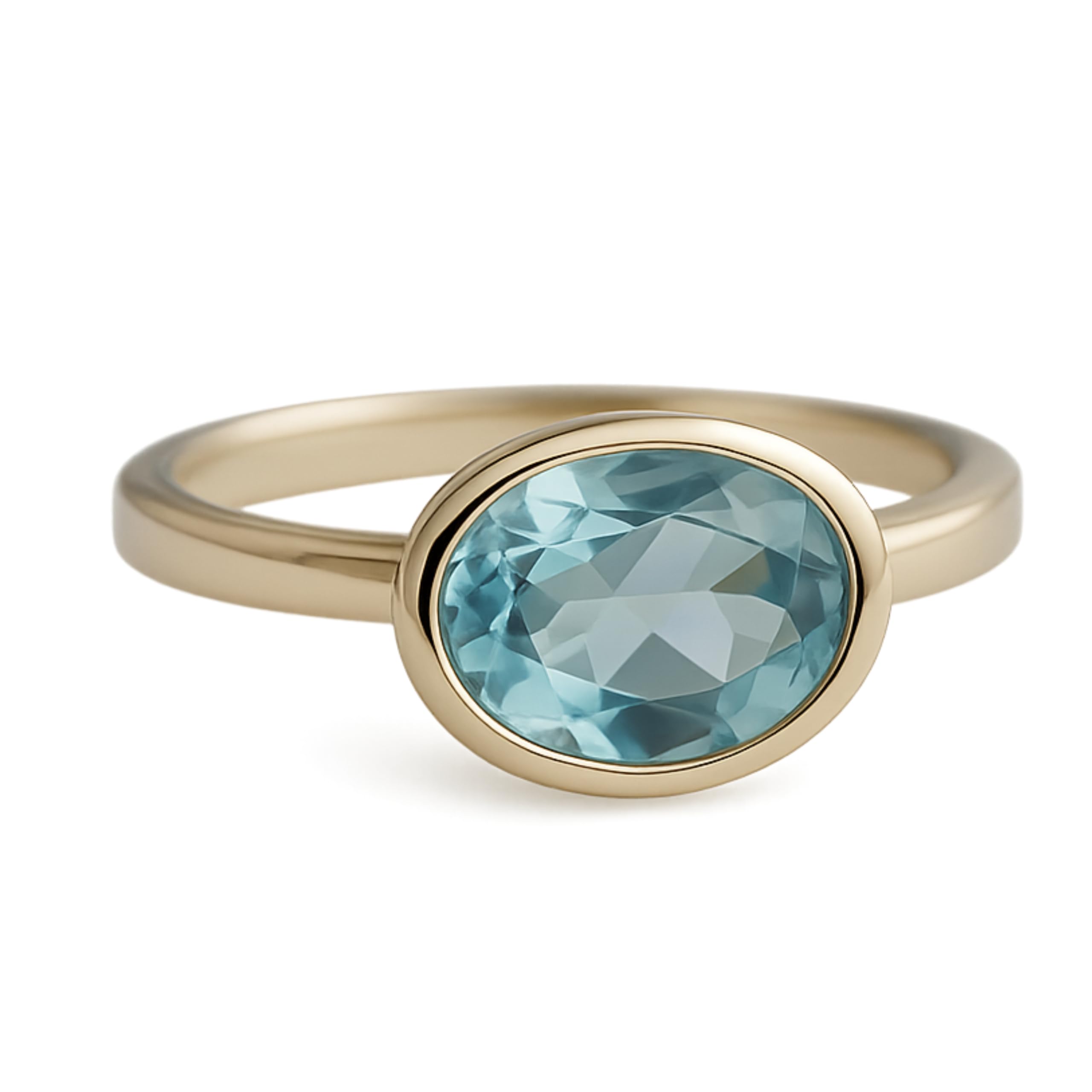 Anillo ovalado de plata de ley con baño de oro y topacio azul