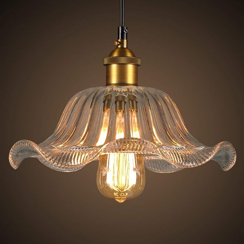 Chandelier industrial de cristal transparente y metal texturizado retro americano