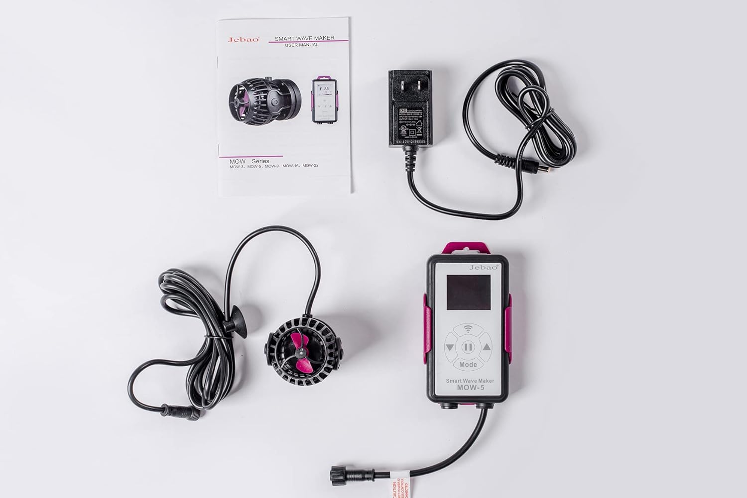All components of the Jebao MOW-5 Smart Wave Maker laid out on a white surface.