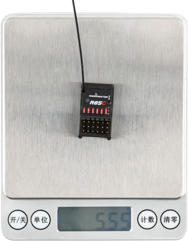 Radiomaster R85C receiver on a digital scale showing 5.55 grams