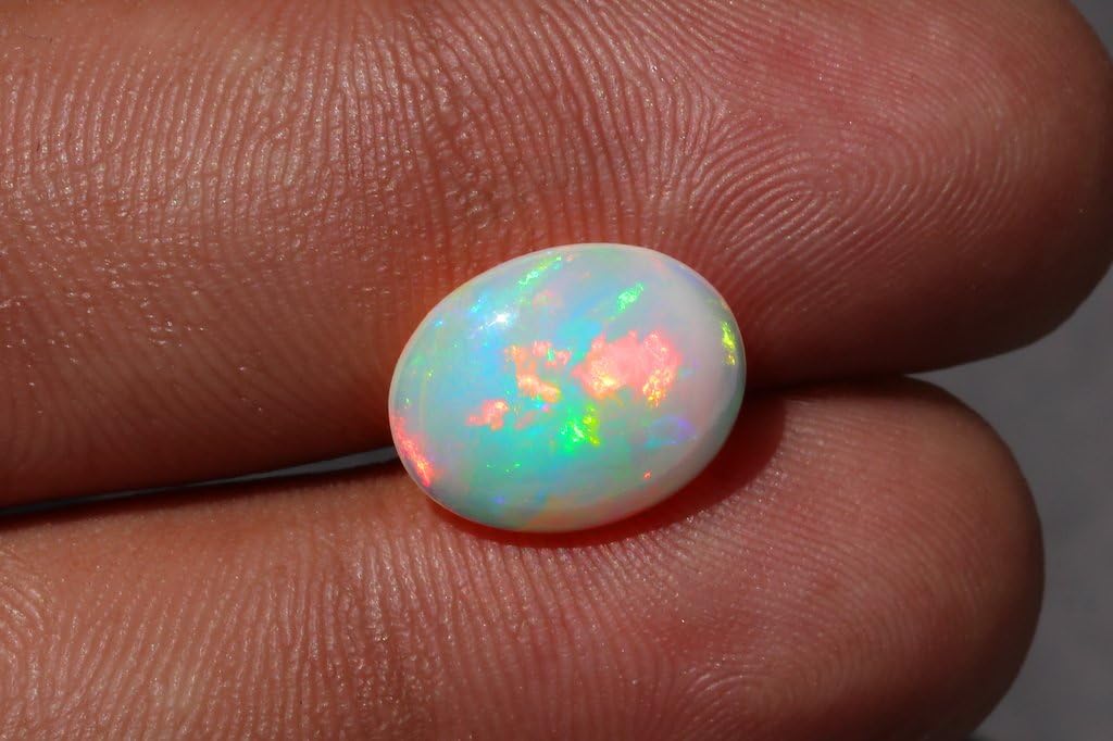 Ópalo etíope de fuego natural Cabujón Piedra preciosa natural Forma ovalada Tamaño 13,2x10,4x4,1 mm Peso 2,4 cts