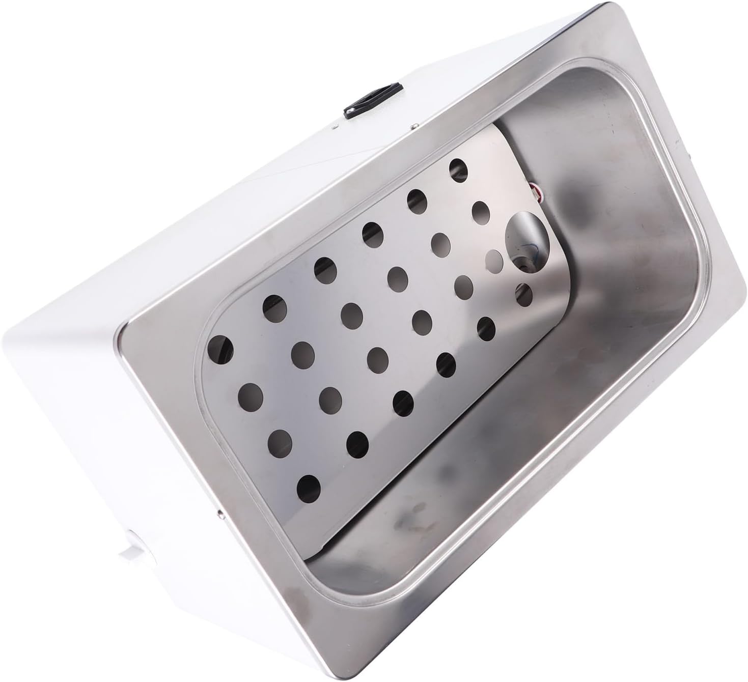 An angled view inside the Fockety water bath heater, showing the perforated stainless steel plate covering the heating element at the bottom.