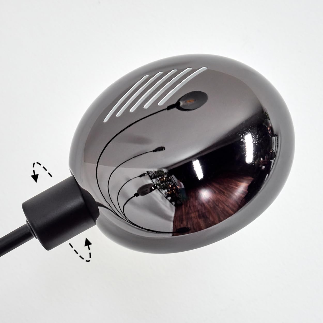 Close-up of one of the adjustable lamp heads, showing its swivel mechanism.