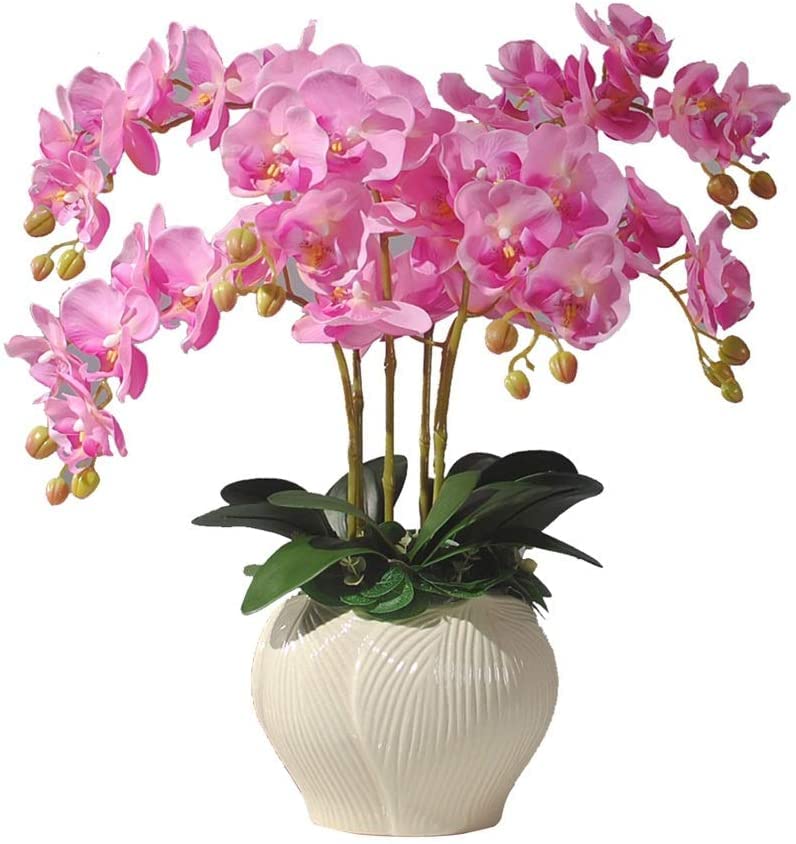 Fleur artificielle phalaenopsis avec vase blanc centre table