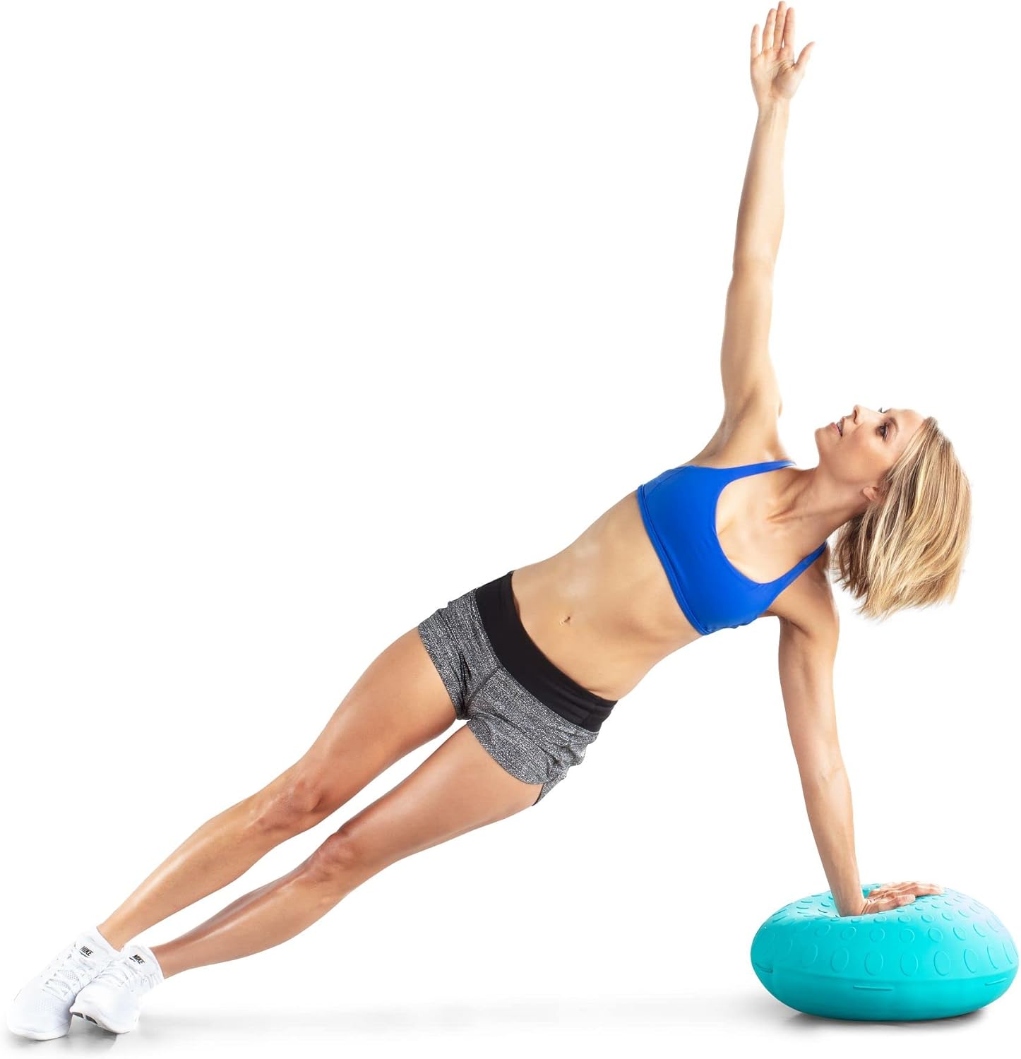 Man performing push-ups with hands on the flat base of the ProForm Balance Ball.