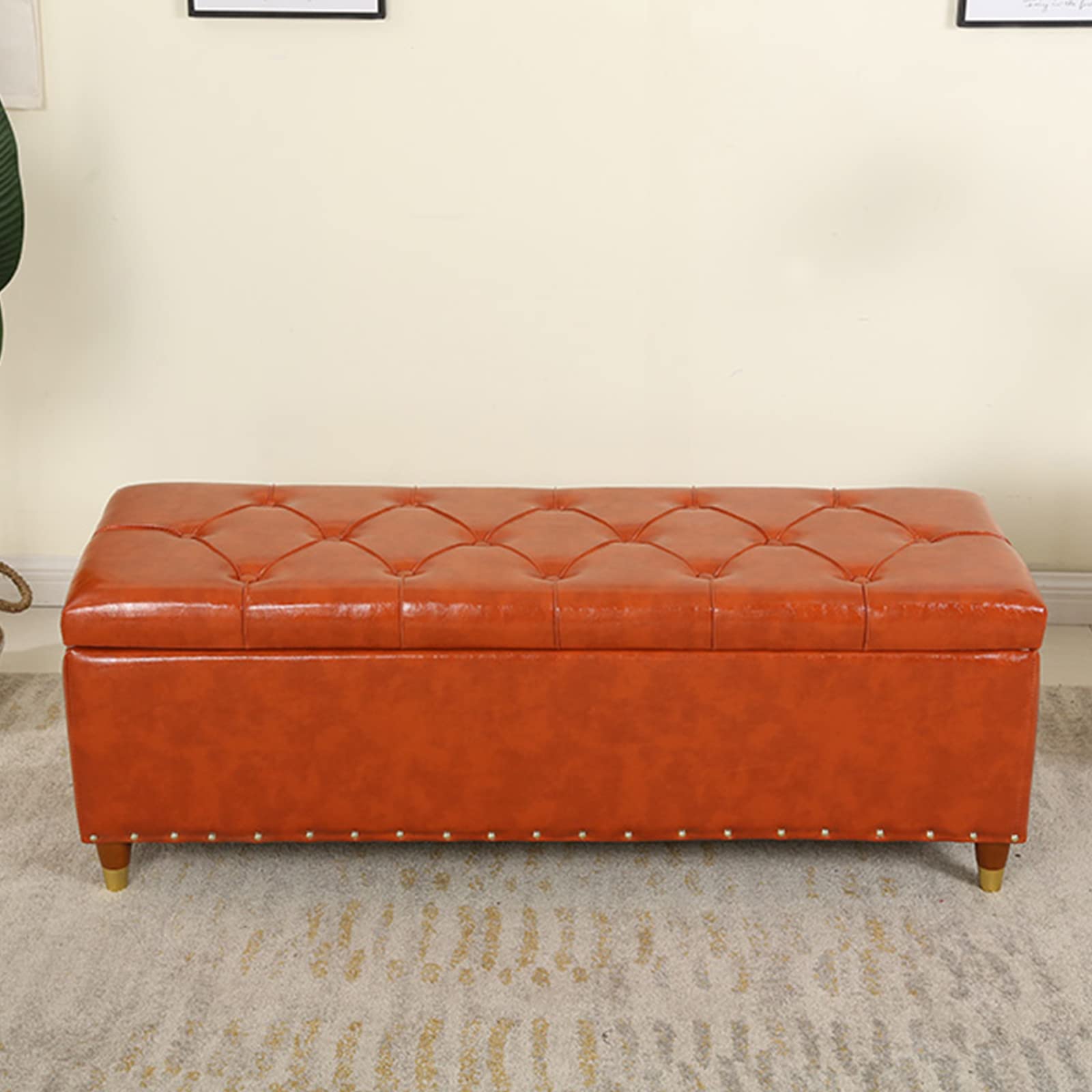 Banc de rangement en cuir capitonné aux finitions haut de gamme