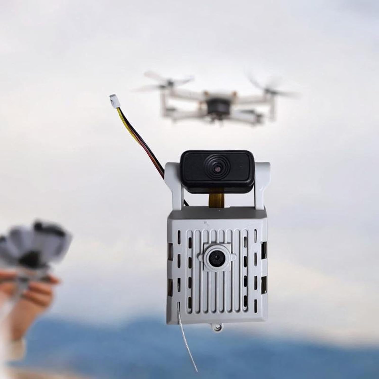 E88Pro E88 RC Quadcopter with bottom cover removed, showing camera module connection point