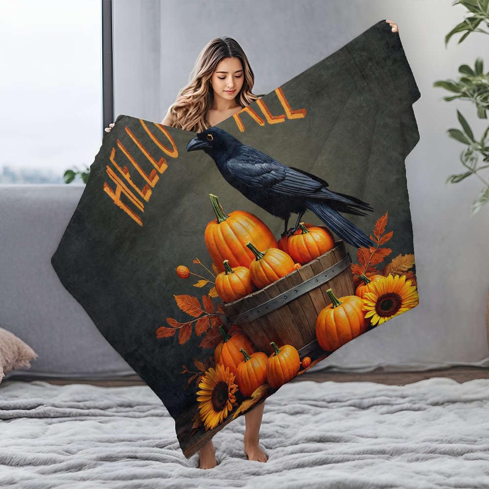 Couverture en flanelle Hello Fall contre les soirées froides sur un canapé inconfortable