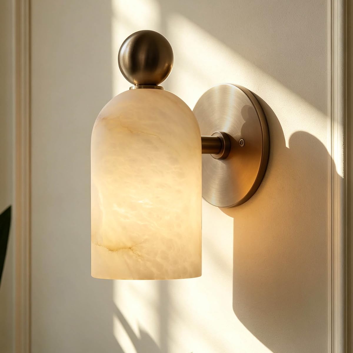 Lámpara pared mármol para espejo baño creando un ambiente de spa privado