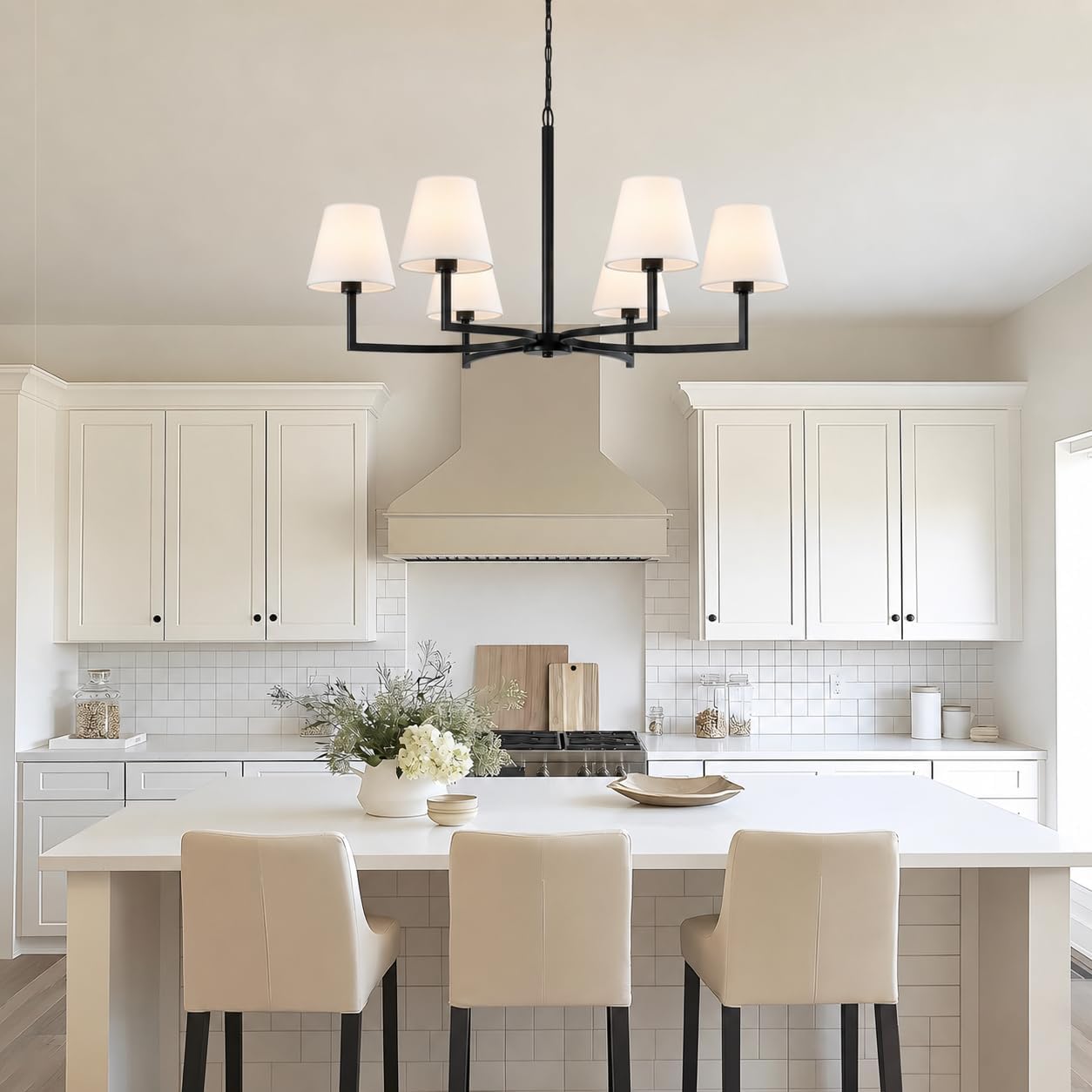 ASHUAQI chandelier installed above a kitchen island in a white kitchen
