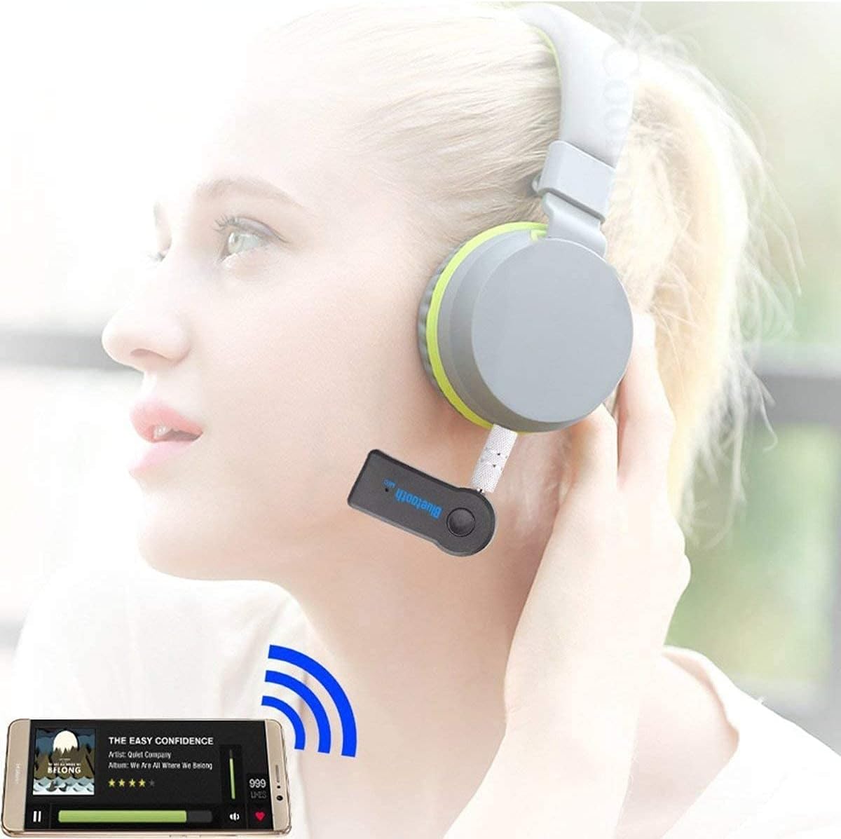UrbanX Mini Bluetooth Receiver connected to headphones, streaming music from a smartphone.
