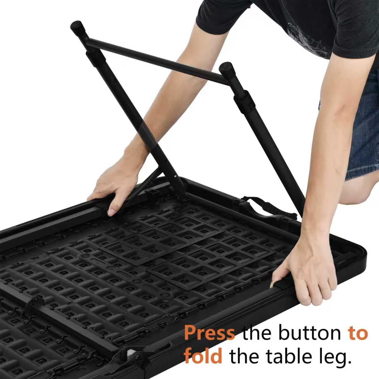 Close-up view of the leg locking mechanism on the underside of the table, showing the pivot point and support bar.