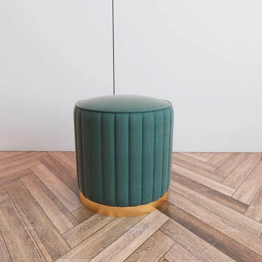 Siège moderne et pouf repose-pieds en fourrure verte pour coin lecture cocooning
