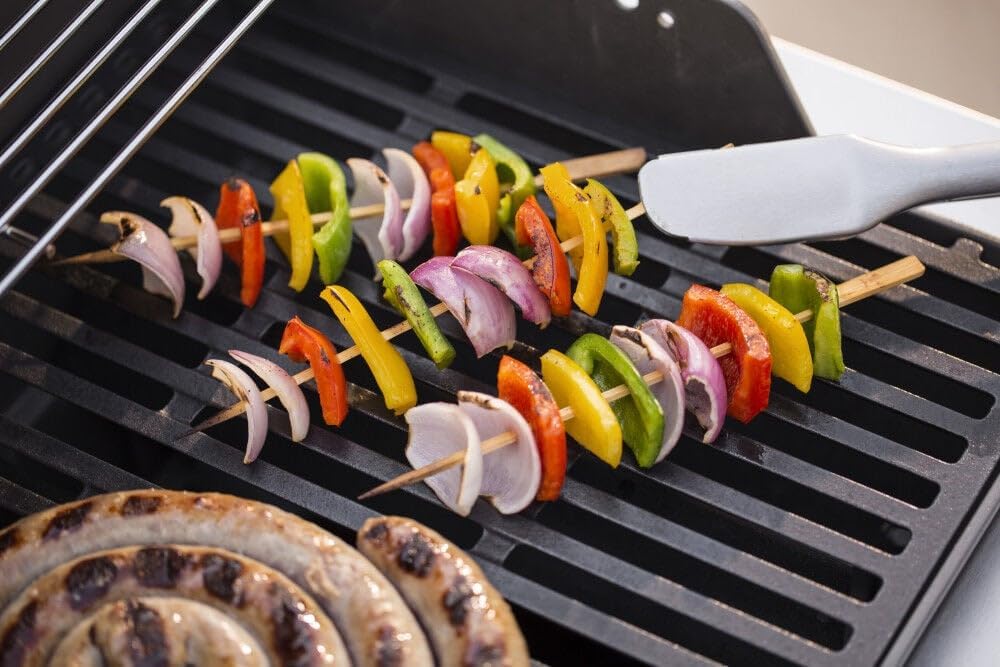 Food cooking on the Weber Spirit E-210 grill grates