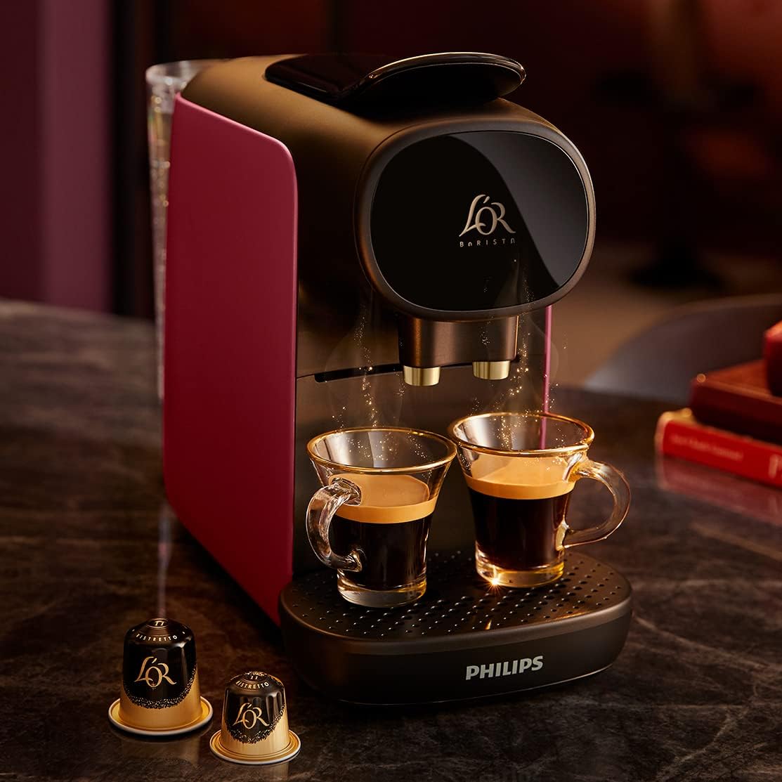 Hand inserting a coffee capsule into the machine