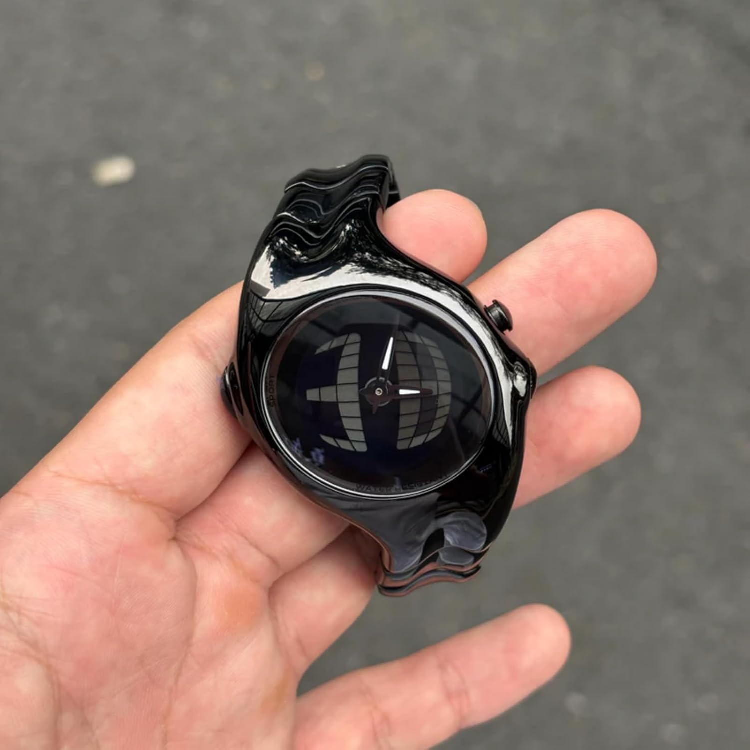BENLYDESIGN GL570 Digital Watch held in a hand, showcasing its size and design.