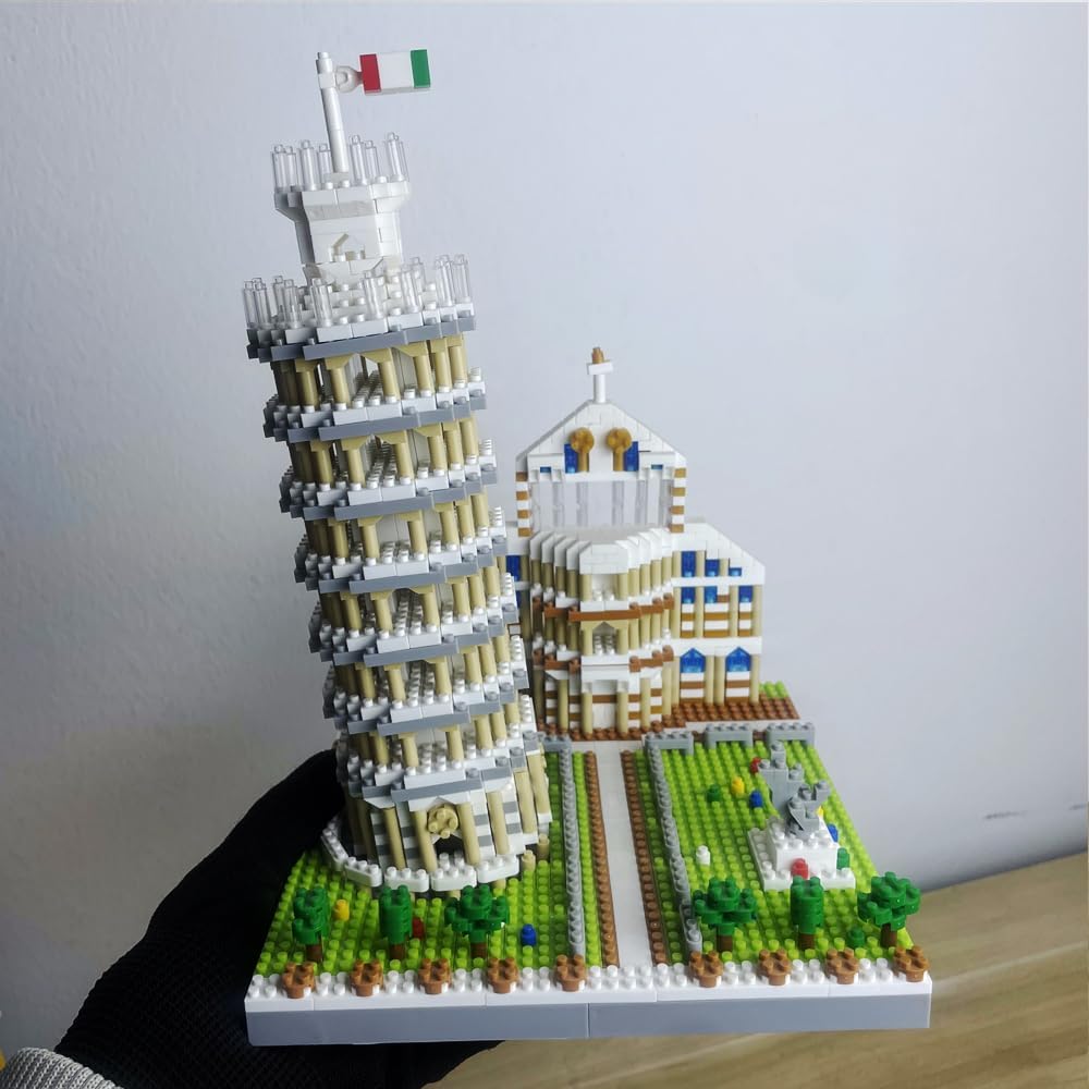 Base of the Leaning Tower of Pisa model with surrounding landscape details.