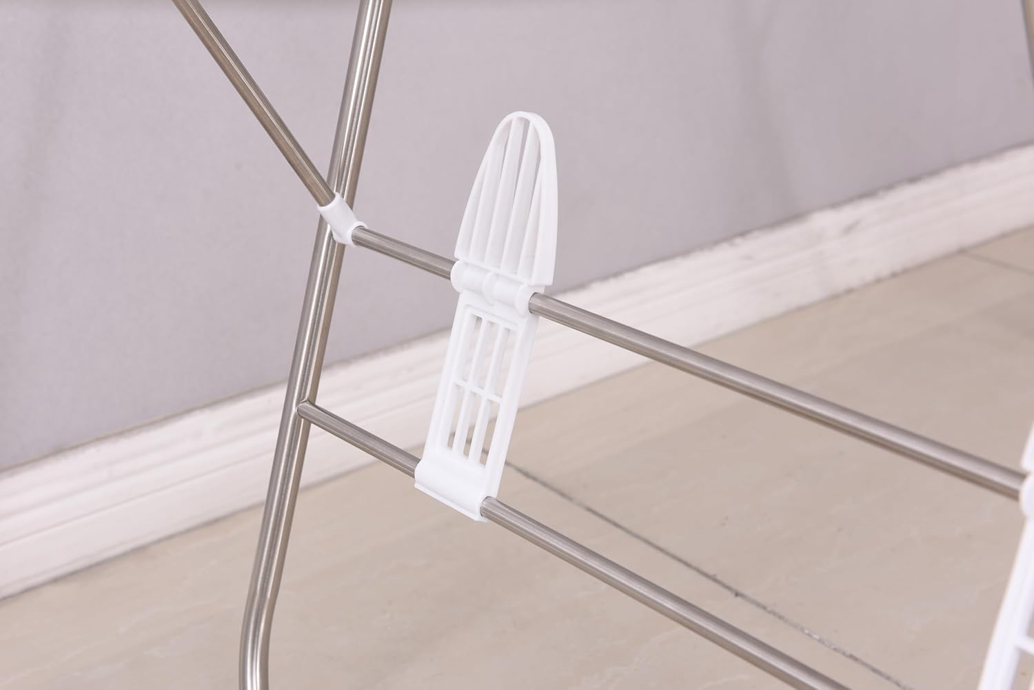 Close-up of towels neatly hung on the stainless steel rods of the EZHOME laundry rack, illustrating proper spacing for airflow.
