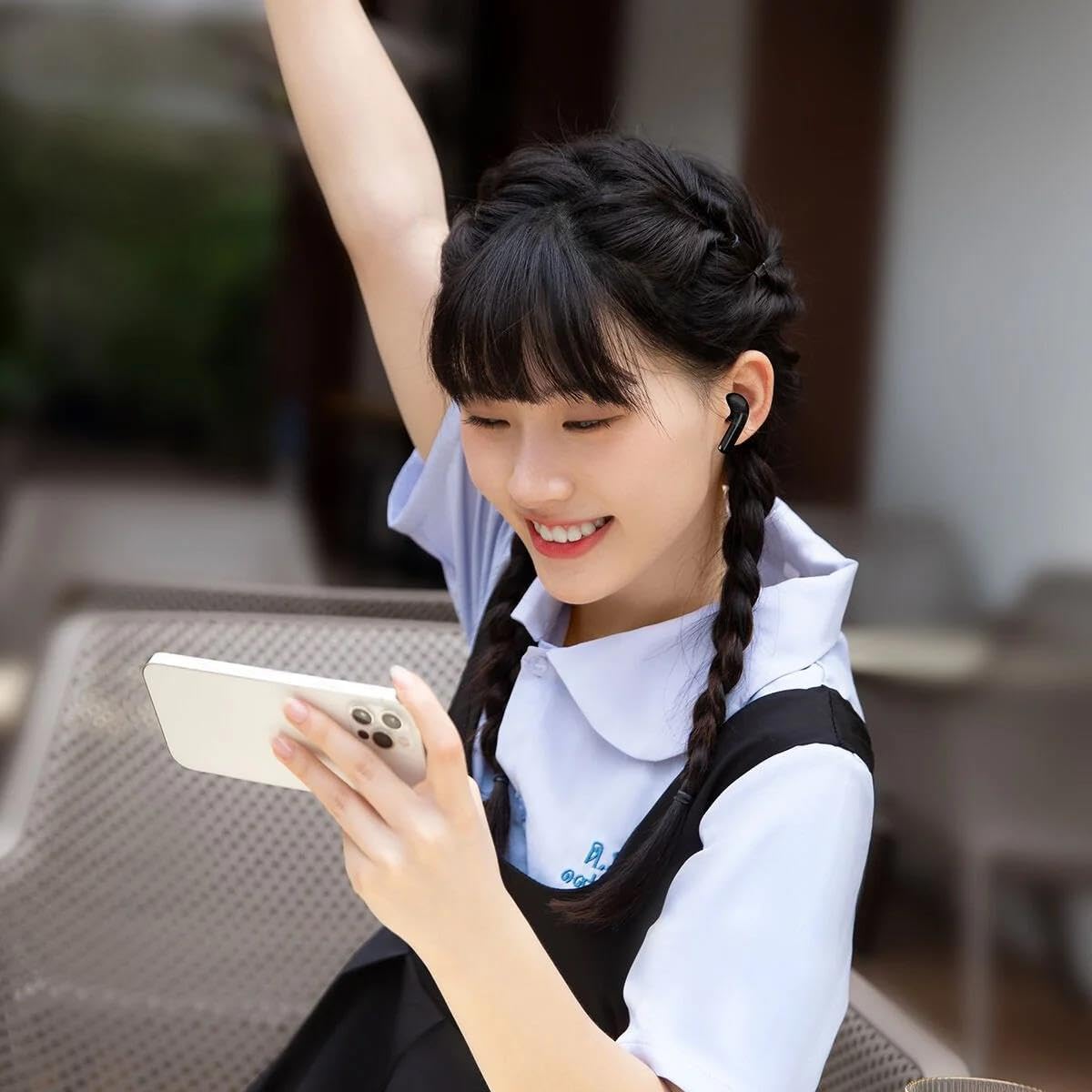 Person wearing BASEUS Bowie E3 Earbuds