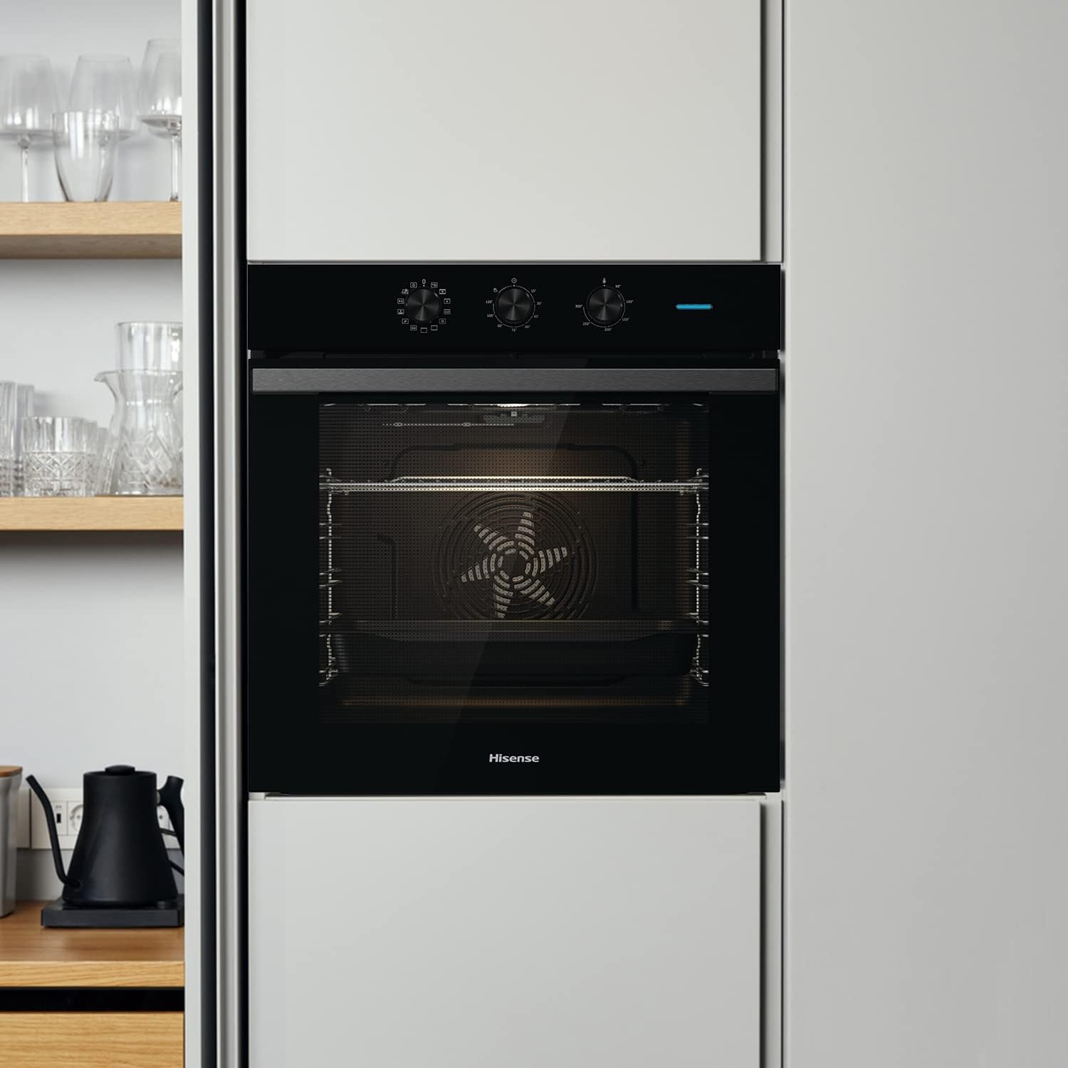 Oven interior with a wire rack and a black baking tray