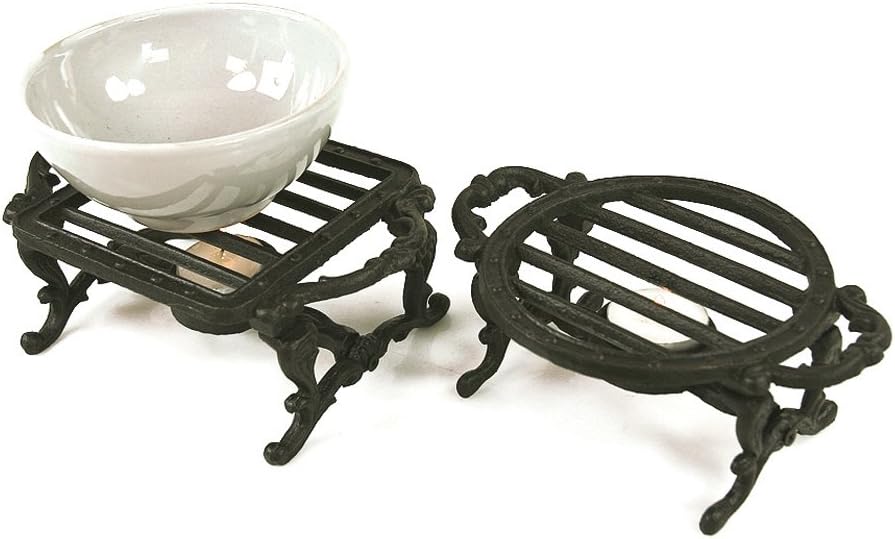 Delightful pair of cast iron trivets and plate warmers - ideal to protect your table and to keep food warm with a tea light