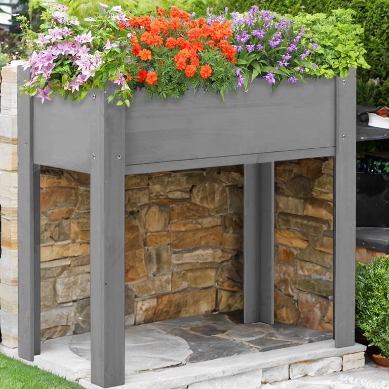 Jardinera elevada de madera para evitar dolores de espalda al cuidar plantas
