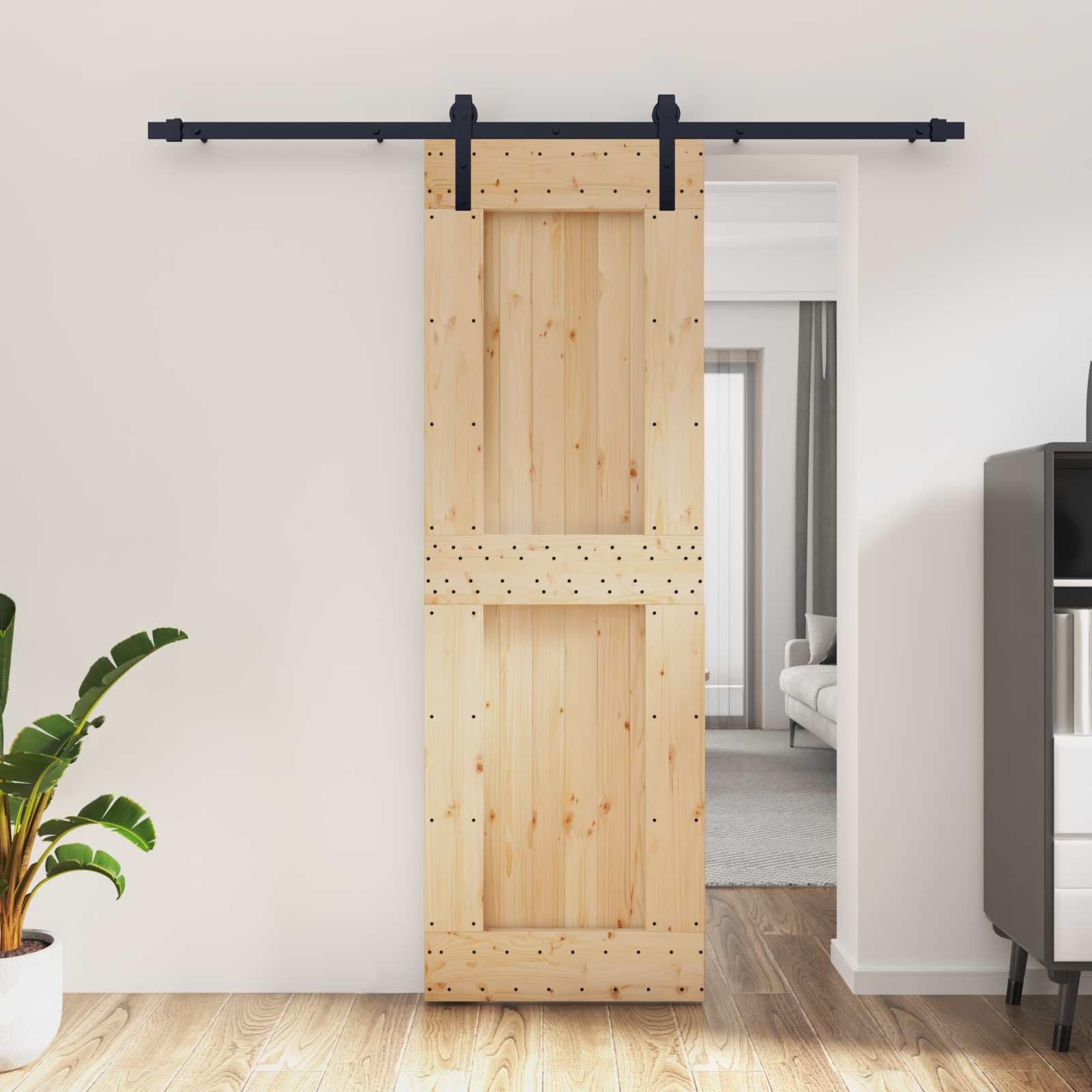 Porte coulissante pin noir 70x210 cm avec son rail en acier pour optimiser l'espace
