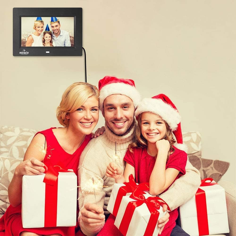 Miracle Digital Photo Frame on a table with a remote control, displaying icons for Photo, Video, Music, Calendar, and Clock functions.
