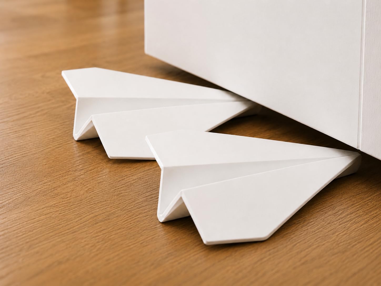 Pilo-Bash Decorative Door Stops 2 Pack, Modern White Door Wedge, Soft TPU Floor Stopper for Home Office and Bedroom, Non-Slip and Lightweight, Paper Aeroplane Design