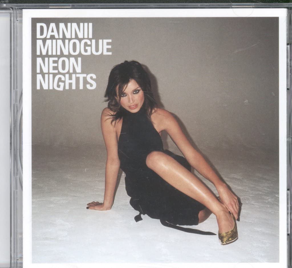 Neon Nights [Audio CD] Dannii Minogue; Terry Ronald; Camille Troillard; Mitch Stevens; James Nisbett; Ian Masterson; Matthieu Joly; Mattias Johansson; Hannah Robinson; Mathias Johansson; John Guldberg; Jewels & Stone; Karen Ann Poole; Bruno Alexandre; Victoria Horn; Gil Cang; Savan Kotecha; Sekou Bunch and Jean Claude Ades