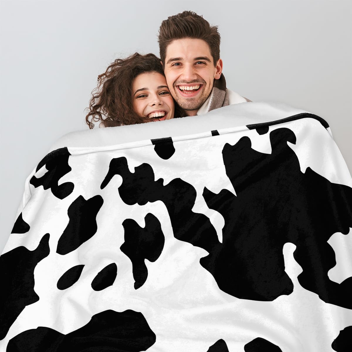 Coperta in pile mucca per divano leggero peluche sfocato